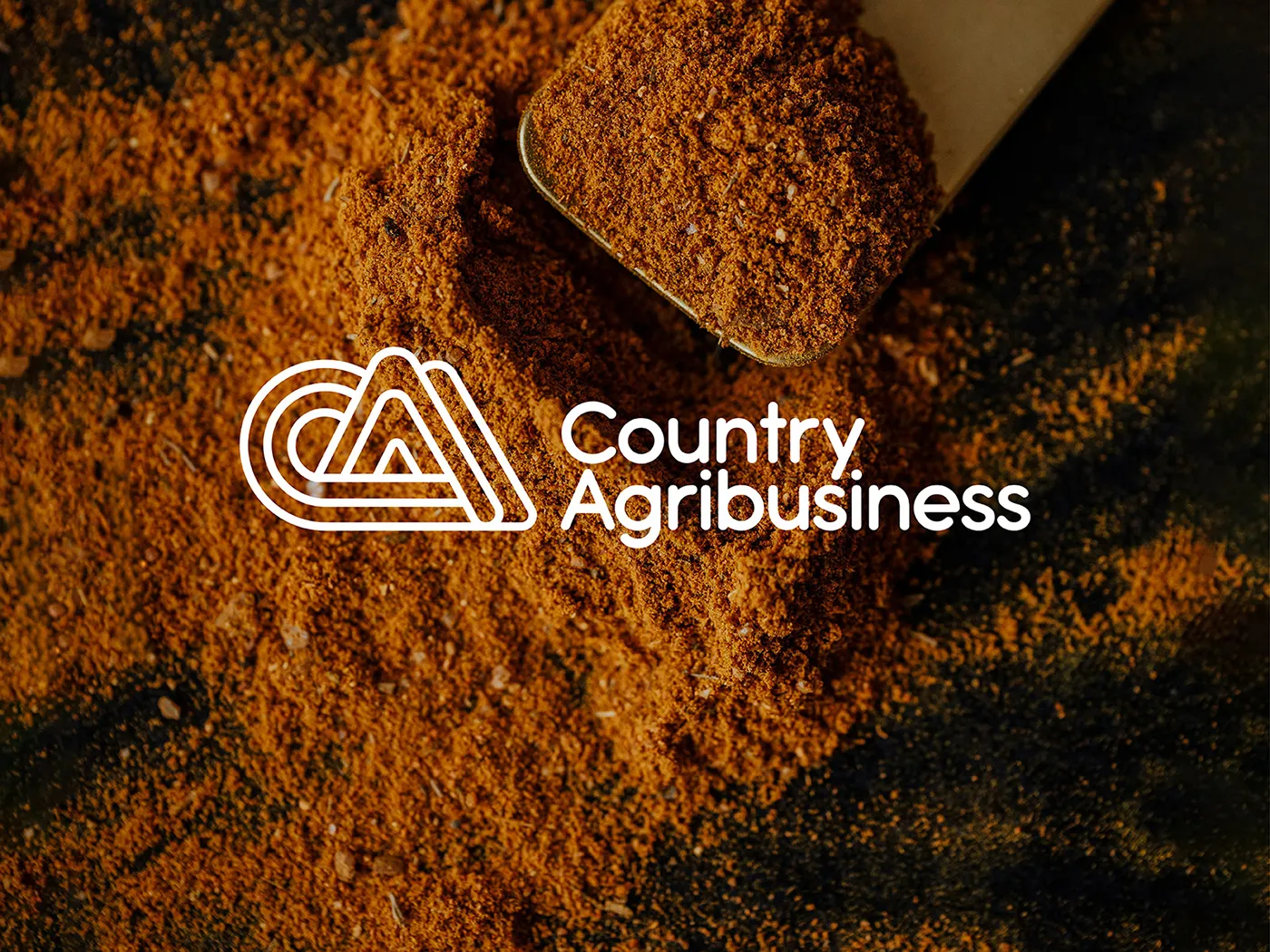 Logo for an agricultural business. The logo has a turmeric spice in the back