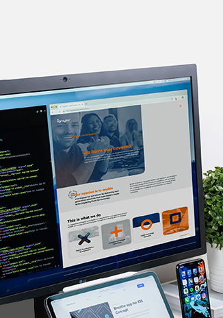Screen devices: A Computer, Tablet a iPhone in a office desk